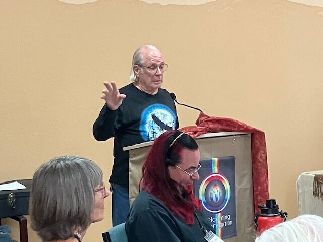 Joe speaking from the lectern.